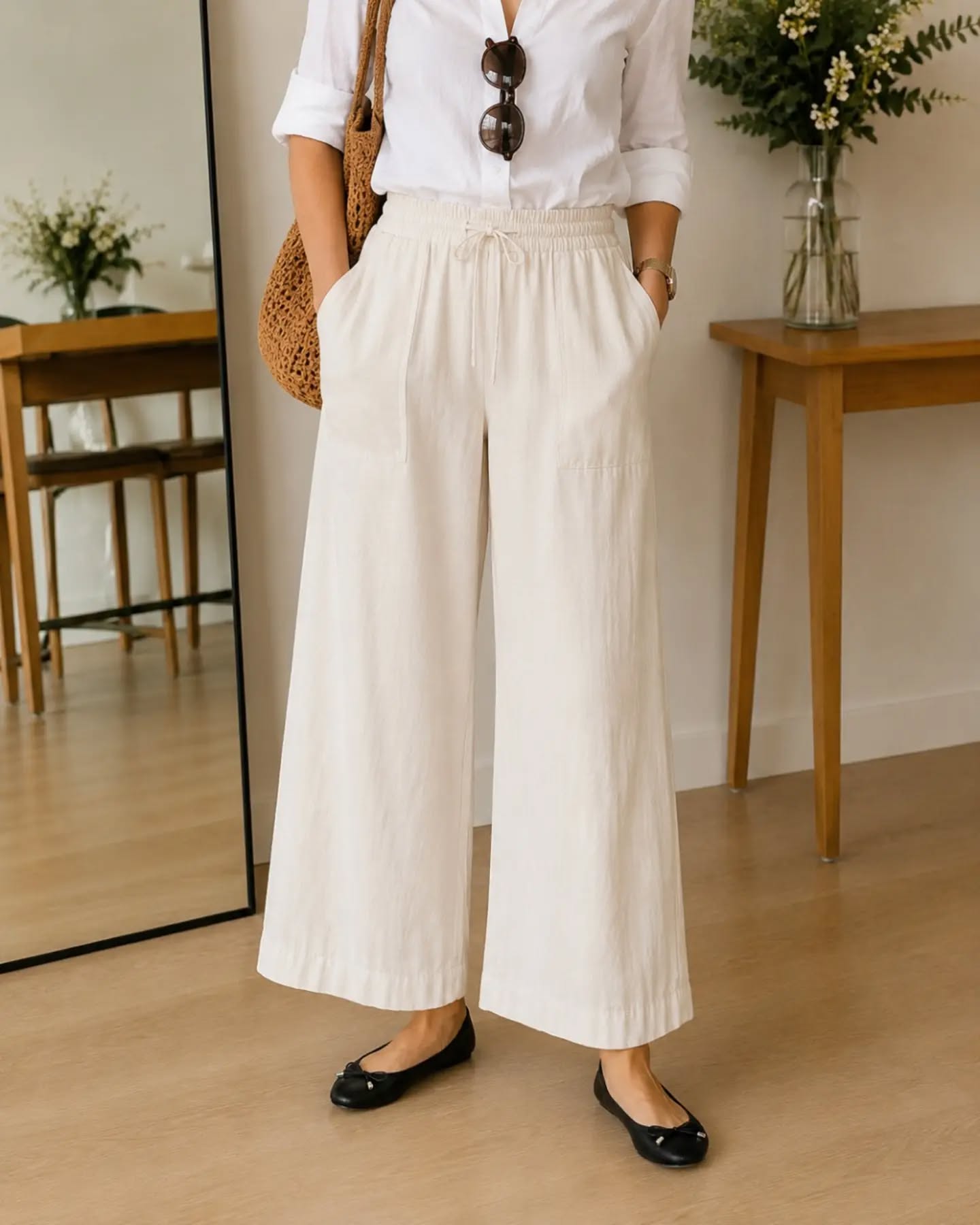 Women wearing balck ballet flats, with baggy white trousers - ballet flats for work