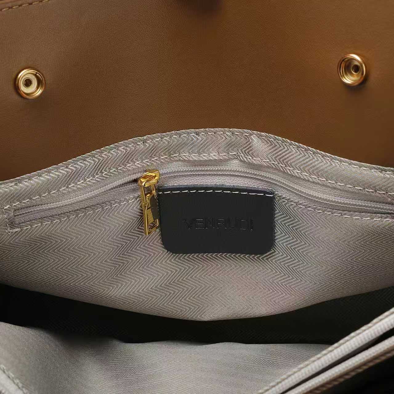 Black Leather Handbag with Tan Belt-Buckle Detail and Detachable Shoulder Strap