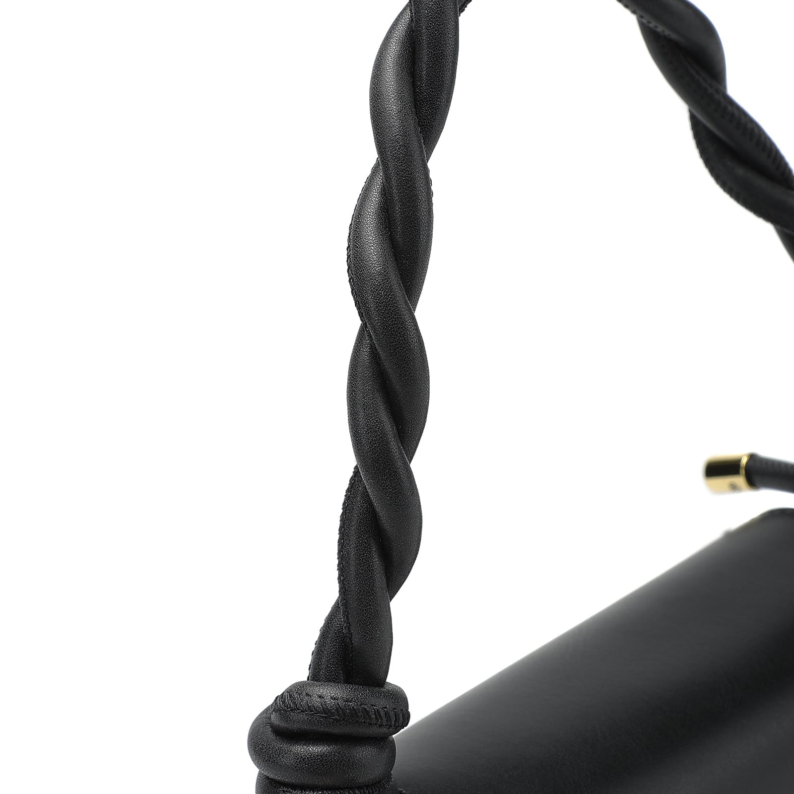 Close-up of a black braided cable with a gold connector on a white background