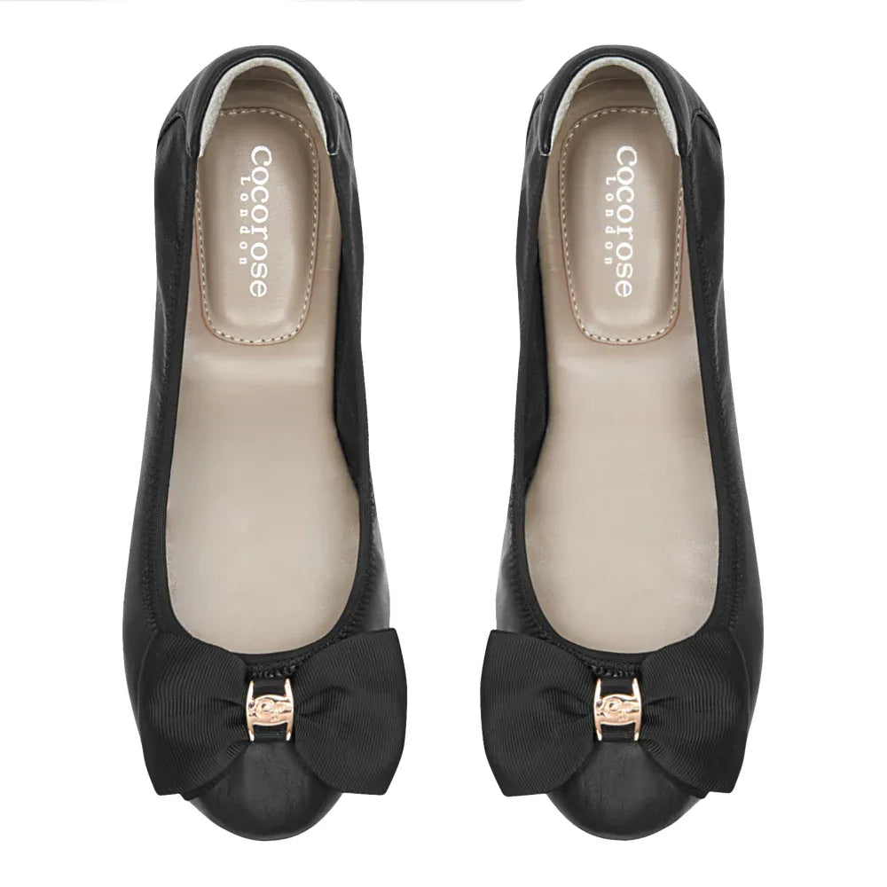 Black Leather Ballerina shoe with black grosgrain bow, soft insole and relaxed upper - by Cocorose London. On white back ground