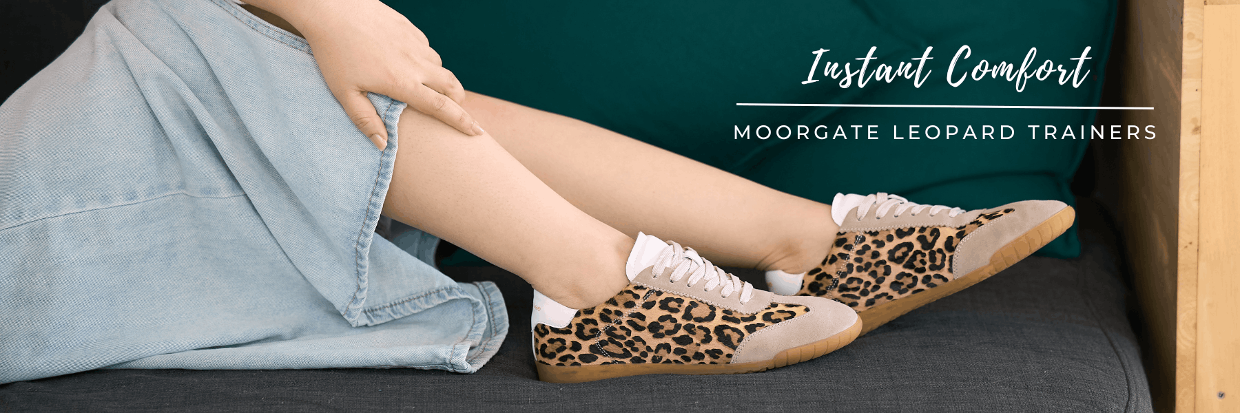 Cocorose Leopard print trainers worn with a light blue denim skirt s on a dark background, featuring text 'Instant Comfort Moorgate Leopard Trainers'.