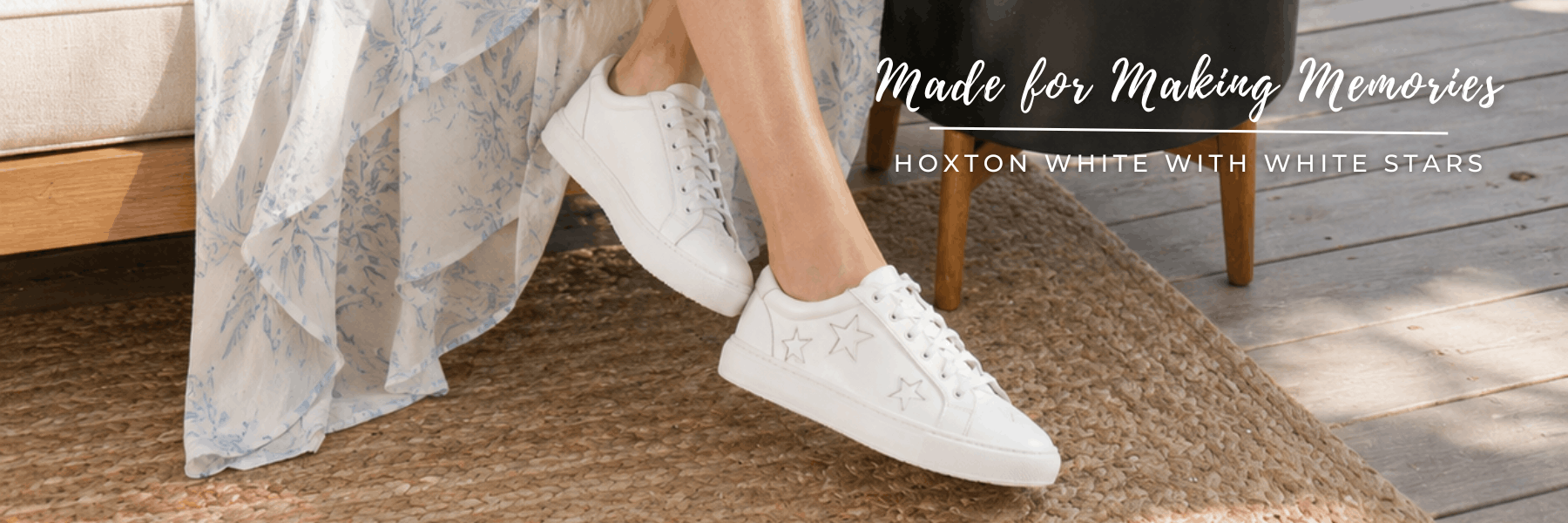 A homepage banner featuring a woman in a floral dress wearing white Hoxton sneakers with star details, with text reading "Made for Making Memories | Hoxton White with White Stars."