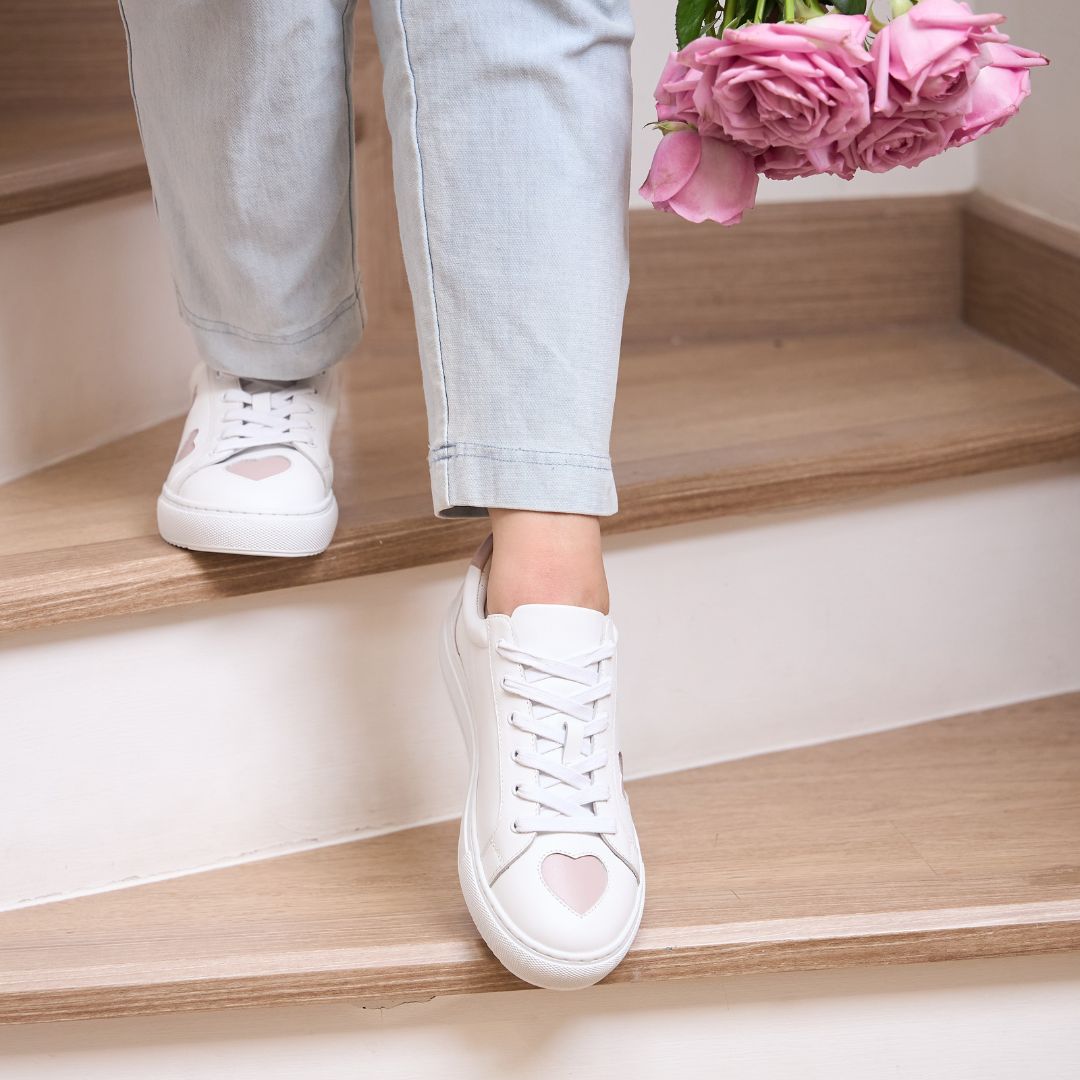 comfortable white leather trainers with fun hearts in pink, red and glitter