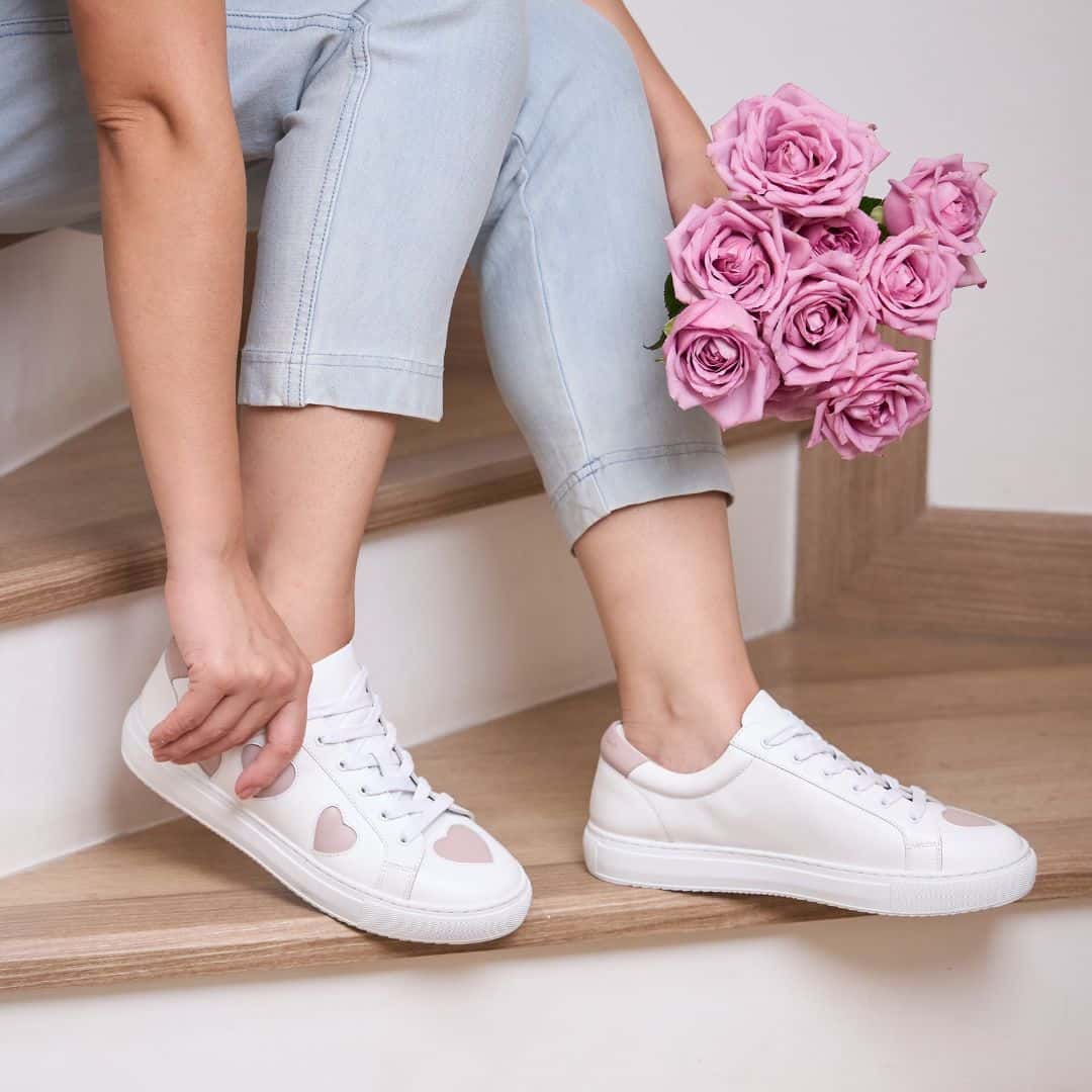 soft and comfy white leather trainers with pink hearts