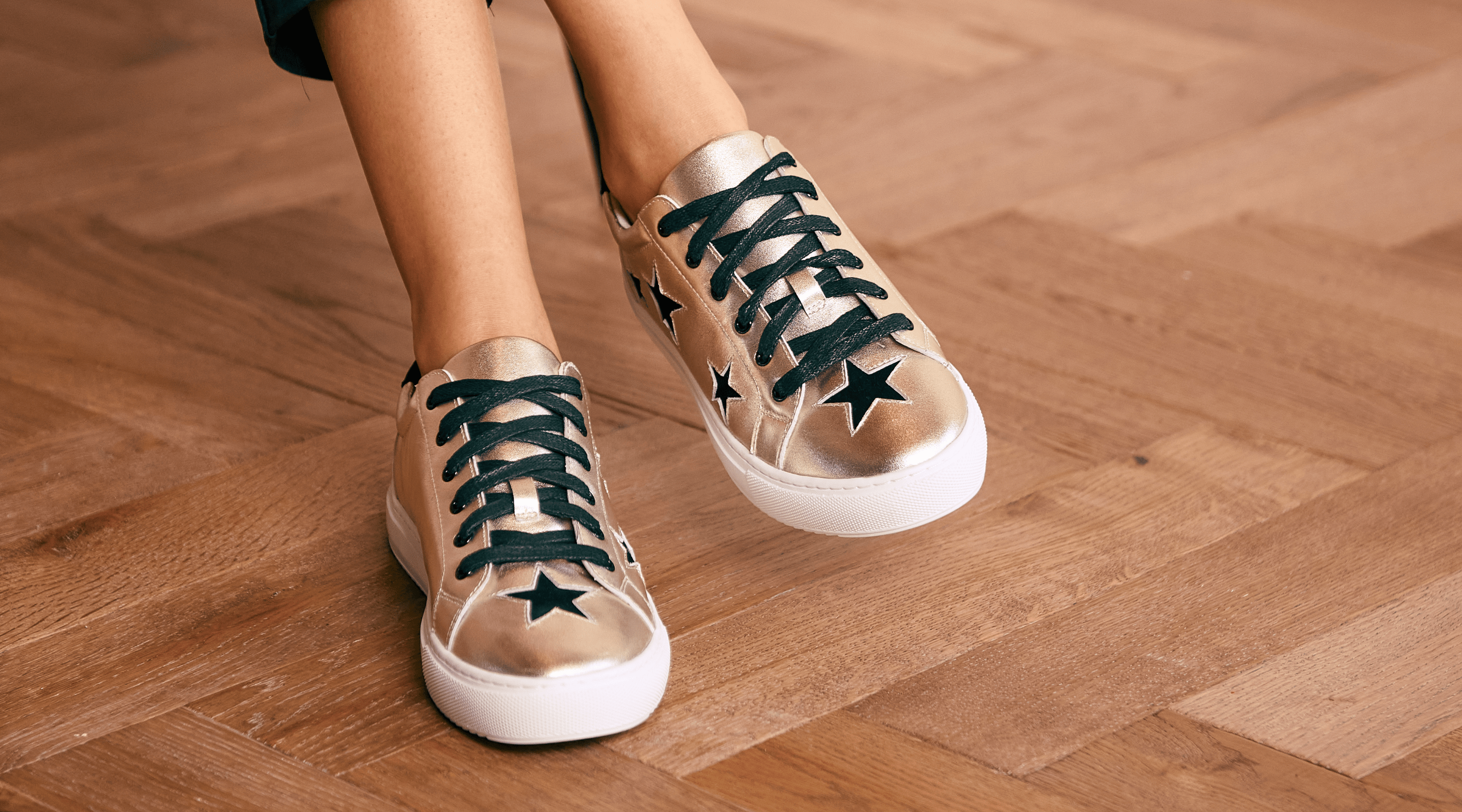 metallic gold sneakers with star detail