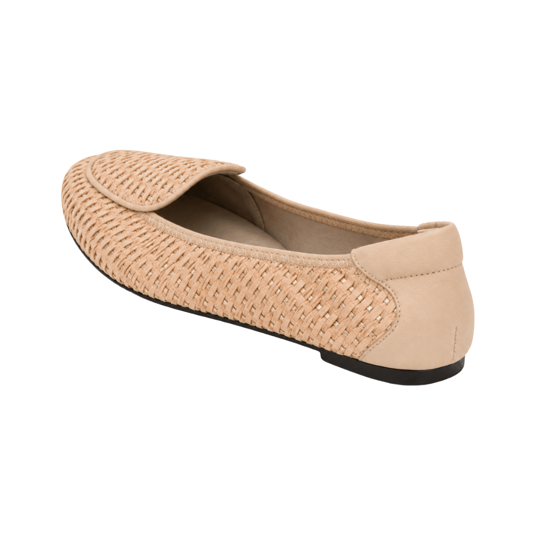 An angled rear view of a single beige woven loafer showing its smooth leather heel counter and thin black sole against a white background.