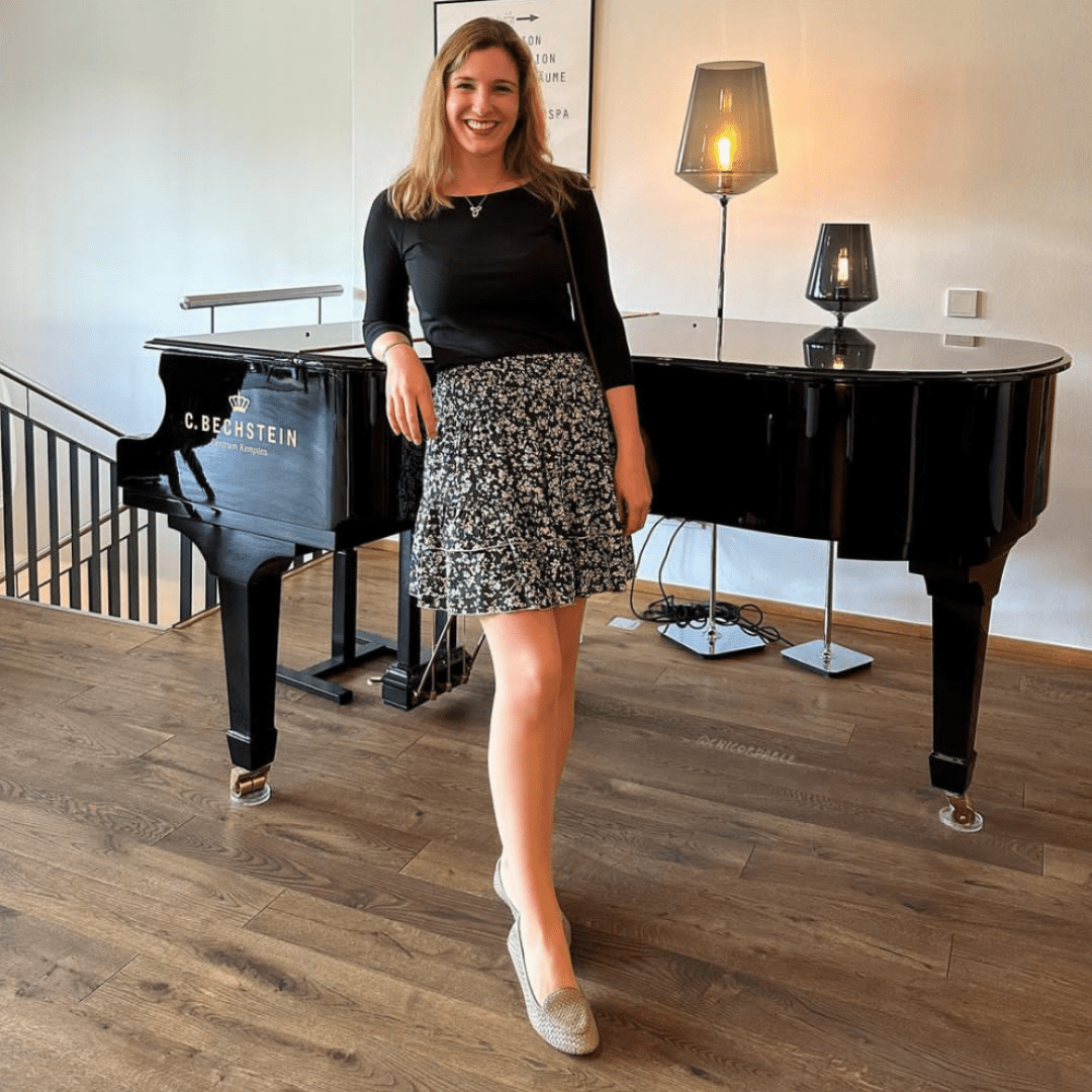 Elegant women’s pink loafers styled with floral skirt