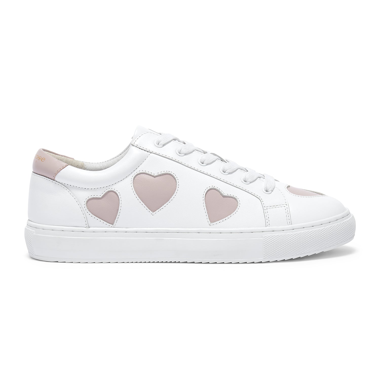 White low top leather trainers featuring pink heart accents for a feminine touch