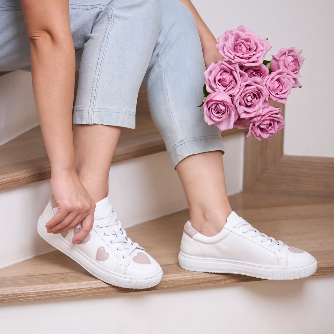 soft and comfy white leather trainers with pink hearts