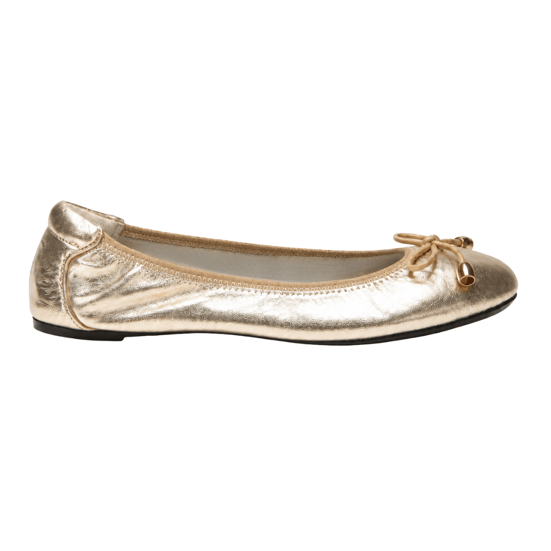 A side profile view of a single crinkled metallic gold ballet flat shoe featuring a beige string bow on the toe, displayed on a solid white background.